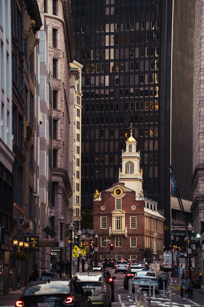 View of the Old State House amidst modern skyscrapers in Boston's city center.